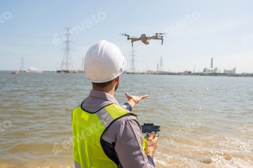 Preview: Engineer Specialists Pilot Drone on Construction Site.