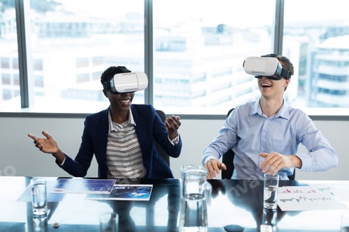 Preview: Smiling executives using virtual reality headset