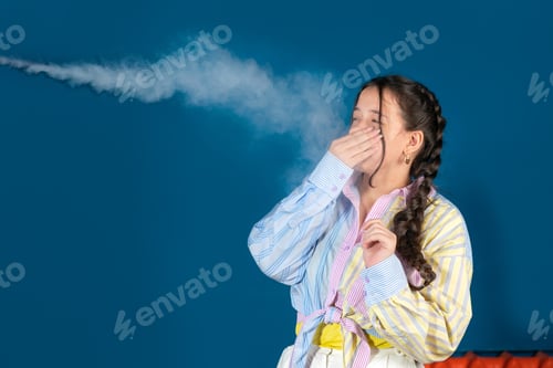 Preview: Passive smoking concept. Teen girl pinch her nose because toxic fumes from car,bad smell