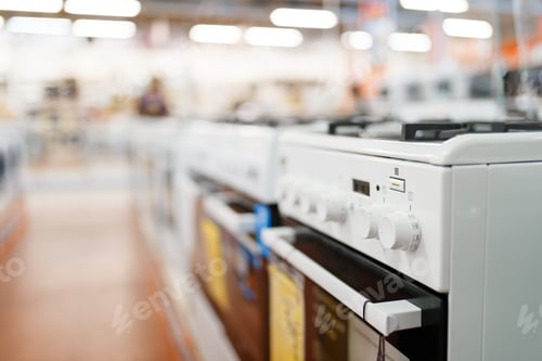 Preview: Row of new gas stoves in electronics store, nobody