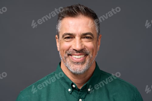 Preview: Happy middle aged business man isolated on gray. Headshot portrait.