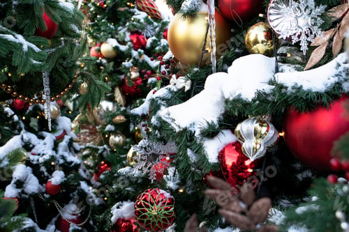 Preview: Christmas tree decorated with colorful balls and toys in the snow