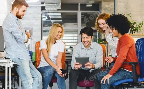Preview: Group of People Using Tablet at Table