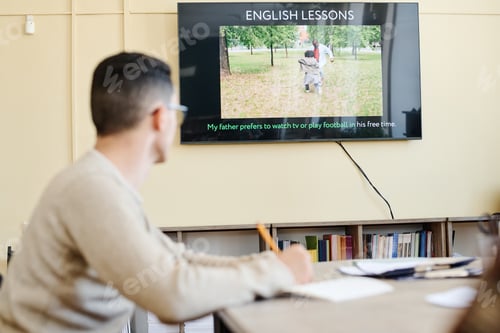 Preview: Student Watching Presentation On Lesson