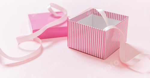 Preview: Gift box open and ribbon on pink background. Girl birthday present concept.