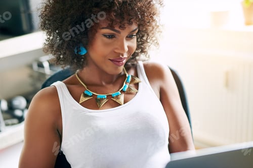 Smiling Woman with Necklace Working Indoors
