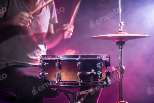 Preview: The drummer plays the drums.
