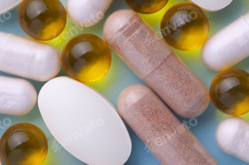 Preview: linseed oil, Fish oil, Pills, tablets, vitamins macro on a blue background