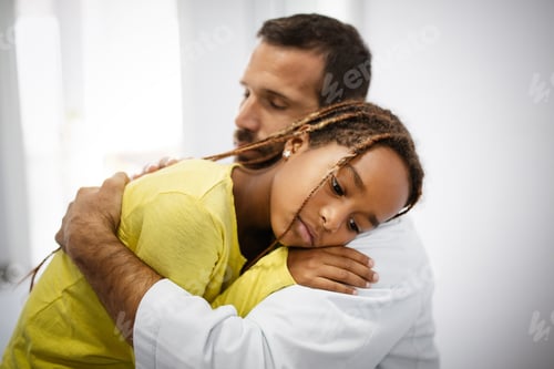 Preview: Doctor comforting, supporting a worried sad girl kid in hospital