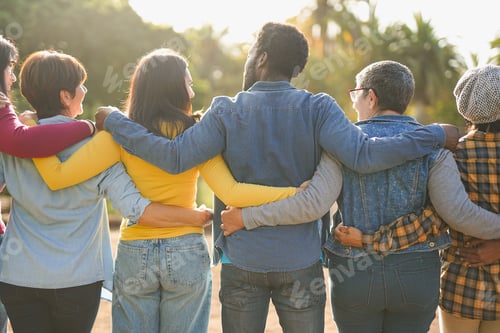 Preview: Group of multiracial people hugging each other at city park