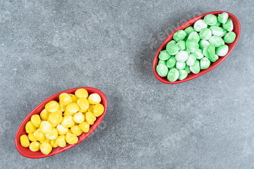 Preview: Two bowls of hard candies on marble surface
