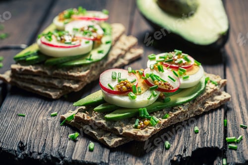 Preview: Tasty sandwich with eggs, avocado and radish