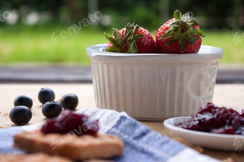 Preview: Whole wheat biscuits with wild berry jam, blueberries and strawberries