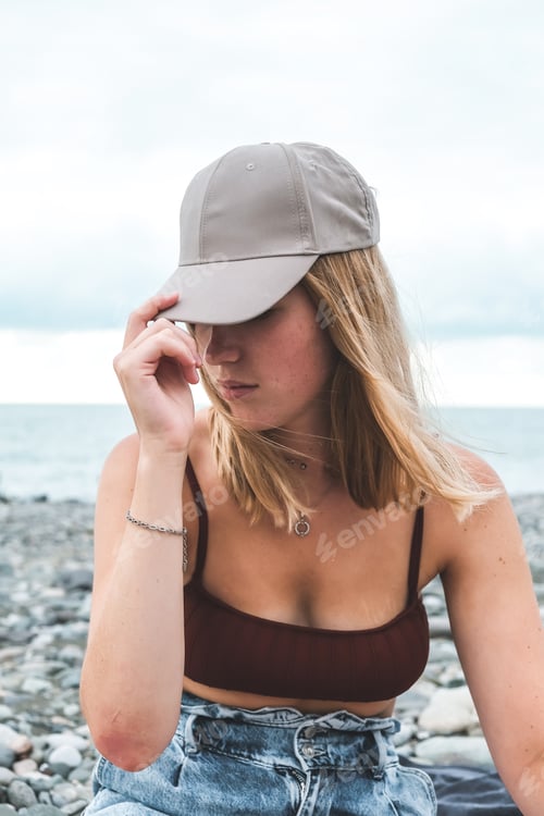 Preview: Travel.Traveler girl resting on the beach near the sea. Eco travel, taking care of yourself physical