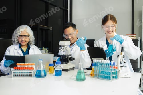 Preview: Scientist mixing chemical liquids in the chemistry lab.