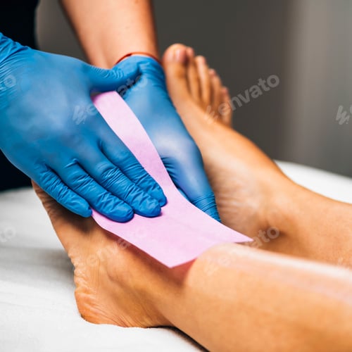 Preview: Waxing - Beautician Removing Unwanted Hair from Female Leg with Wax Strips