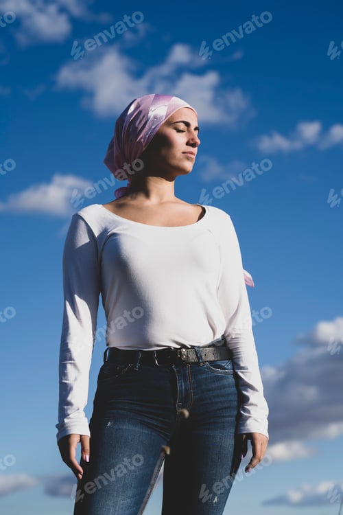 Preview: Young beautiful woman with cancer bandana