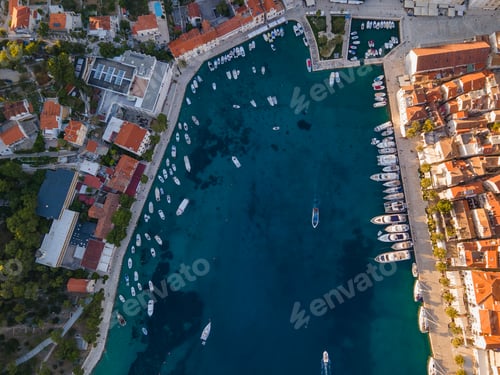 Preview: Top view of Hvar harbor with boats and red roofed buildings on the coastline