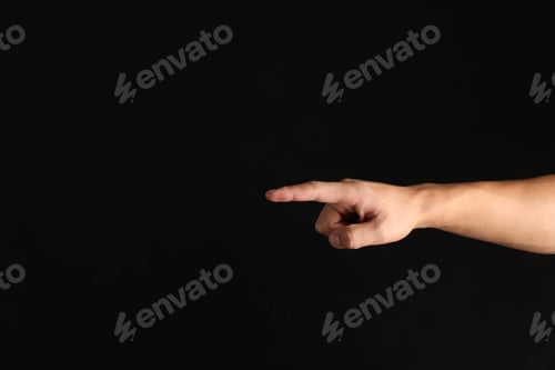 Preview: Man touching something on black background, closeup. Space for text