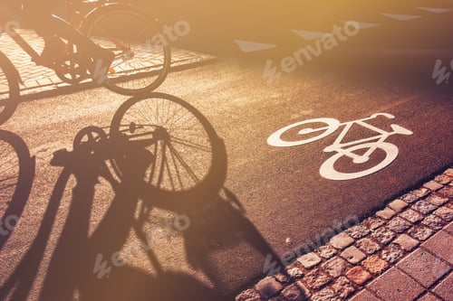 Preview: Shadow of cyclist on bicycle lane