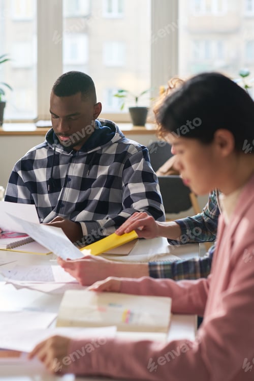 Preview: Collaborative Team Working on Documents in Office