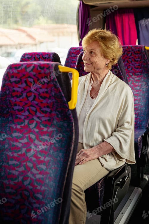 Preview: Senior Woman sitting on travel Bus and waiting for excursion