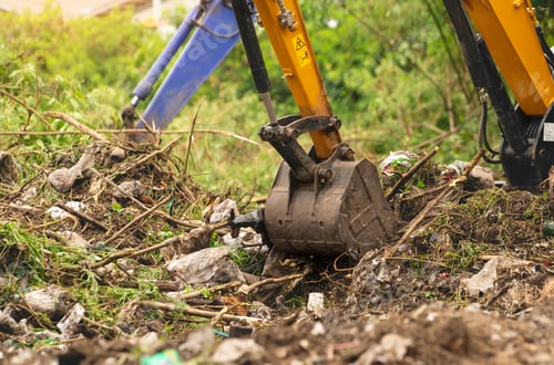 Preview: Backhoe digging soil at construction site. Bucket of backhoe digging soil. Clearing and grubbing.