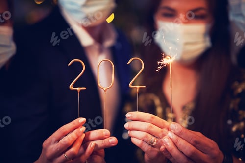 Preview: Two beautiful young couples having fun at New Year's Eve Party