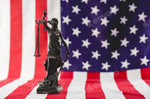 Preview: selective focus of justice statue near american flag
