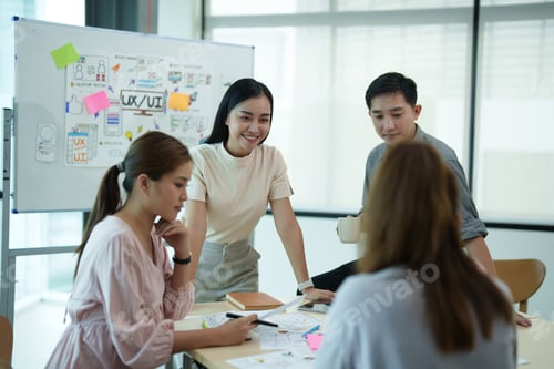 Preview: Group of asian creative teamwork discuss at business meeting for developing mobile phone app project