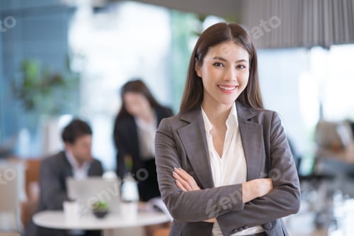 Preview: Portrait of successful young asian businesswoman at office