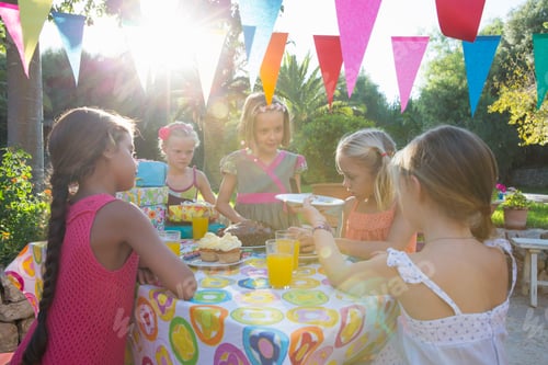 Preview: Girl serving friends birthday cake