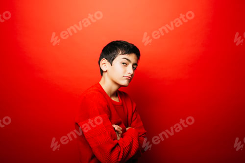 Preview: Pre-adolescent boy with a cool attitude over a red background