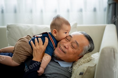 Preview: Infant and Senior Together on a Sofa