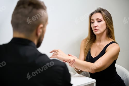 Preview: Patient is consulting with a doctor physiotherapist in rehabilitation center