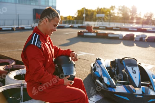 Preview: Young Man Resting on Go Kart Track