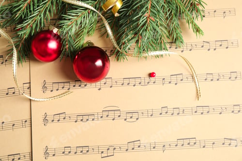 Preview: Flat lay composition with Christmas decorations on music sheets