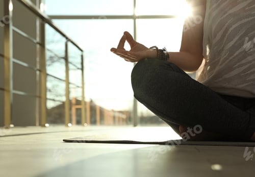 Preview: Young woman practicing yoga in sunlit room, closeup with space for text