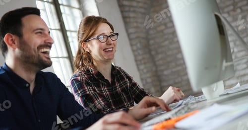 Preview: Portrait of young designers working on computer