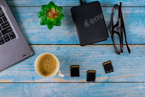 Preview: Top view photographers desktop glasses and coffee