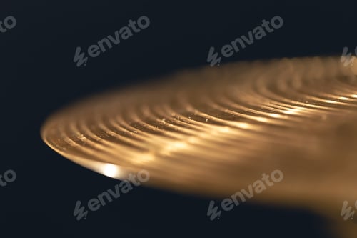 Preview: Drum cymbal close-up on a dark background.