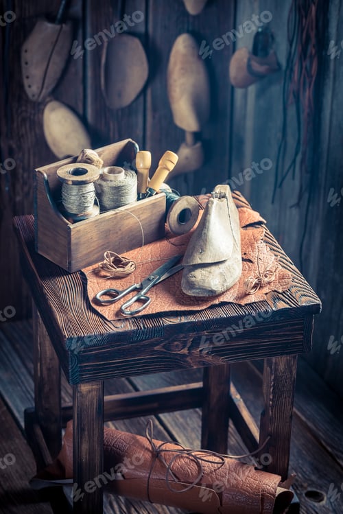 Preview: Small cobbler workshop with shoes, laces and tools
