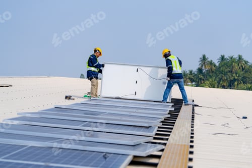Preview: workers installing solar panels, for efficient energy on rooftop