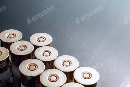Preview: Rifle bullets or cartridges on black shiny background