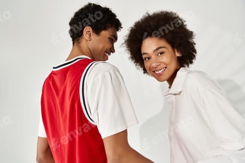 Preview: Young couple shares joyous moments in stylish outfits showcasing their affectionate bond