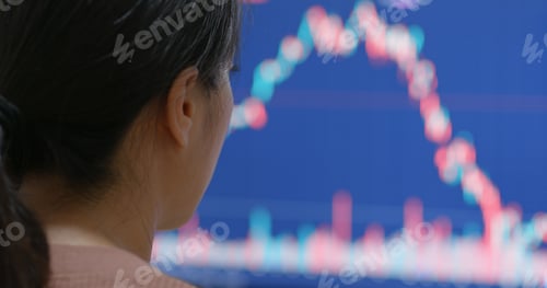 Preview: Woman watching the stock market graph