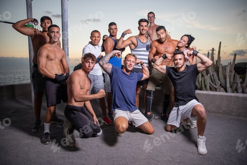 Preview: Group of athletes together after the end of a workout at the outdoor gym,sporty people together