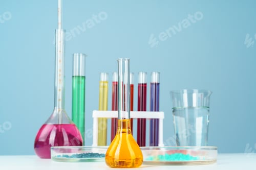 Preview: Chemical laboratory glassware with various colored liquids on table