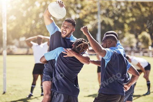Preview: Diverse rugby teammates celebrating scoring a try or winning a match outside on a sports field. Rug