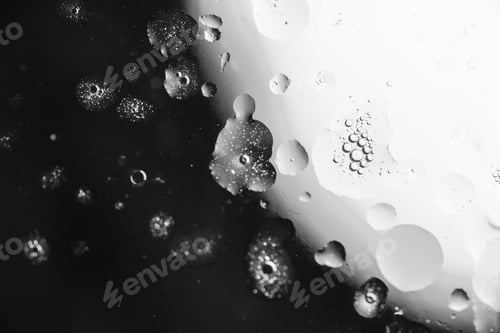 Preview: Macro of oil drops on the water abstract macro background